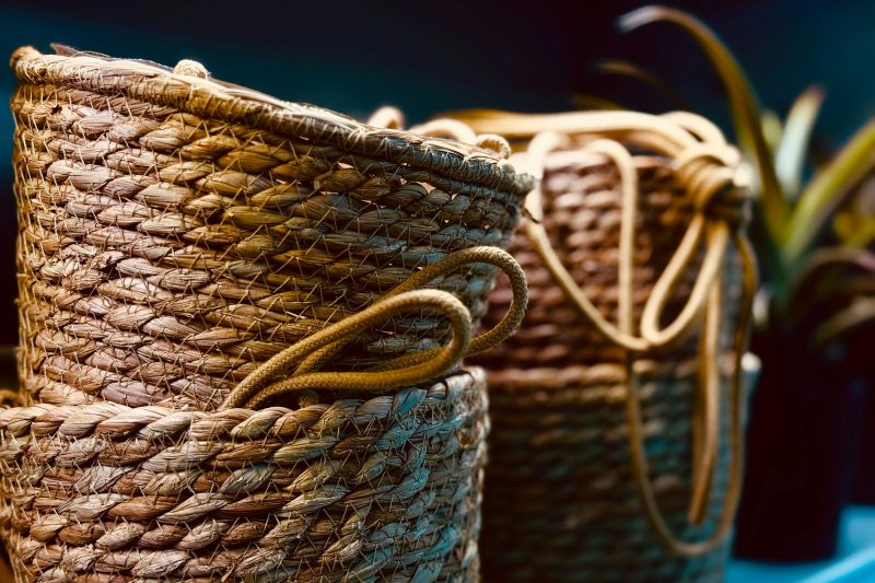 Stacked woven storage baskets with rope handles